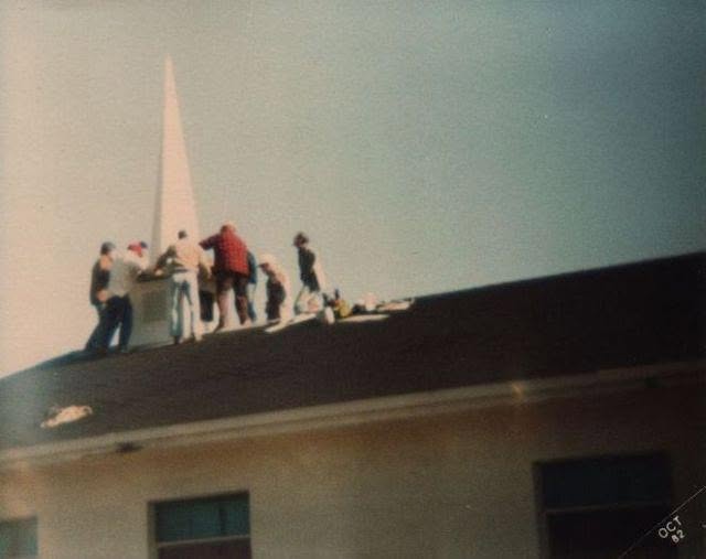 Volunteers installing the church steeple in 1982